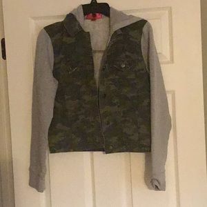 Camouflage jacket with fleece sleeves and hood.